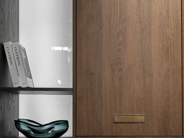 Tall wooden storage cabinet next to open shelves